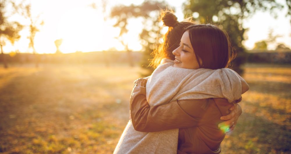 Two women hugging