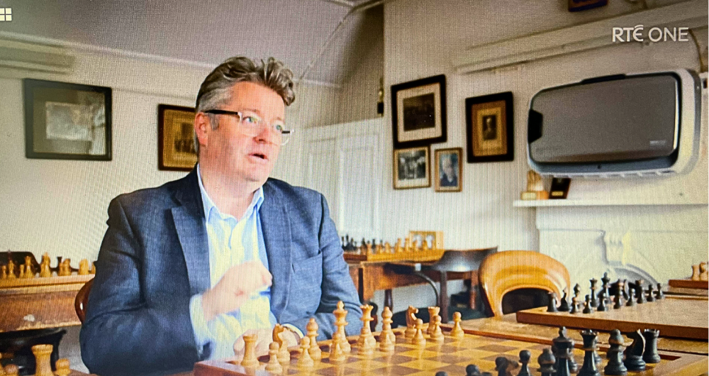 Professor barry O'Sullivan seated at a chess board