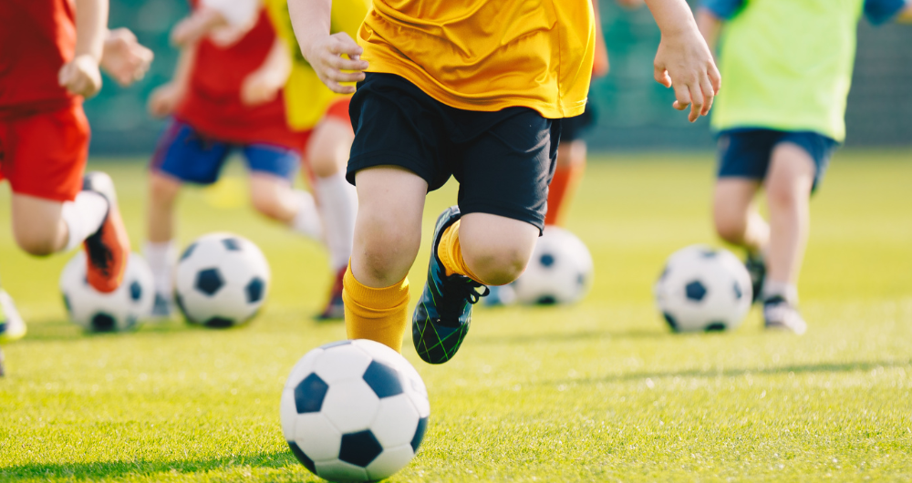 Child playing football