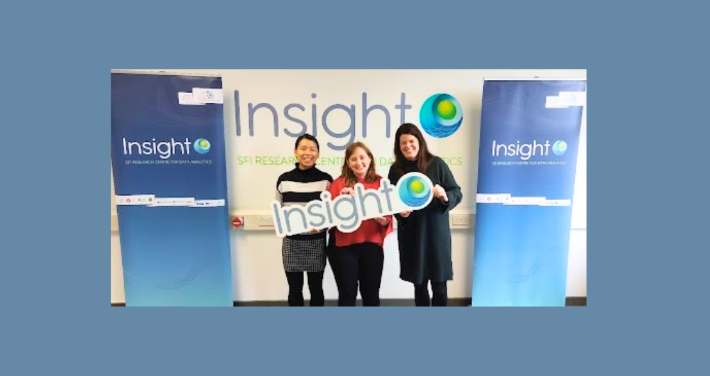 International Women's day speakers holding an Inisght logo