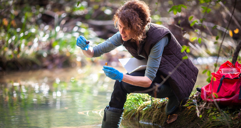 female researcher testing water